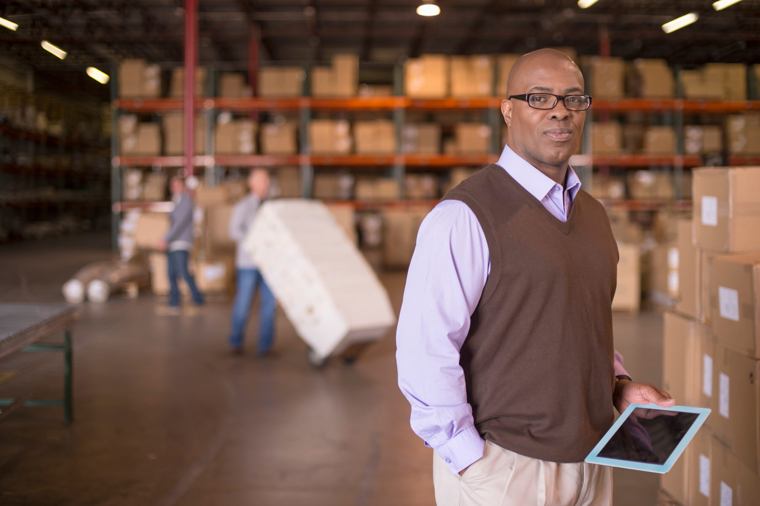 Portrait of warehouse manager with digital tablet